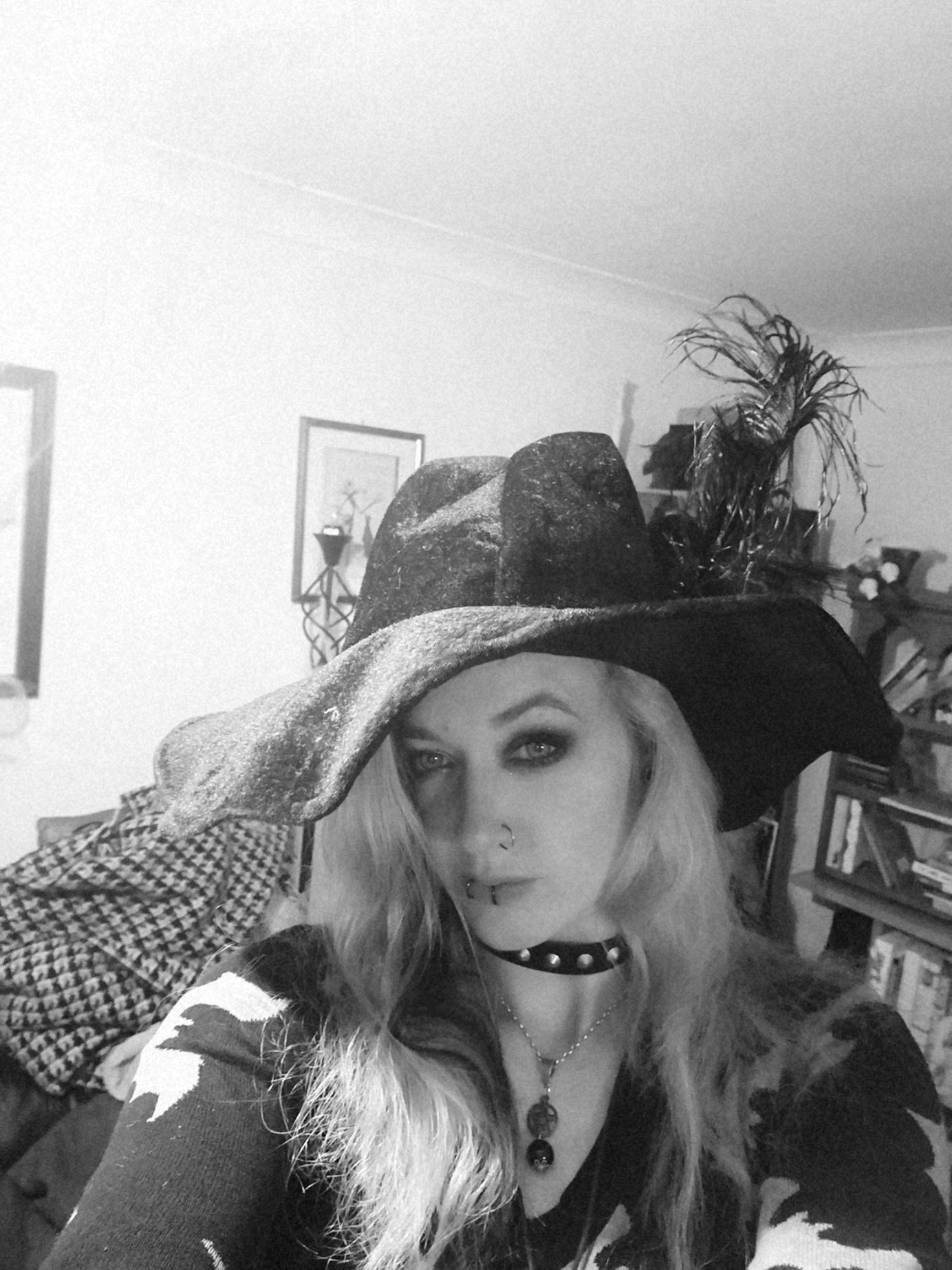 A woman wearing a witch hat